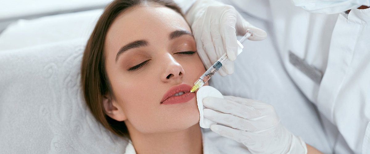 Woman with google receiving fraxel laser treatment