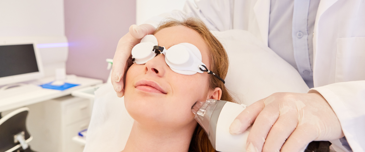 Woman with google receiving fraxel laser treatment